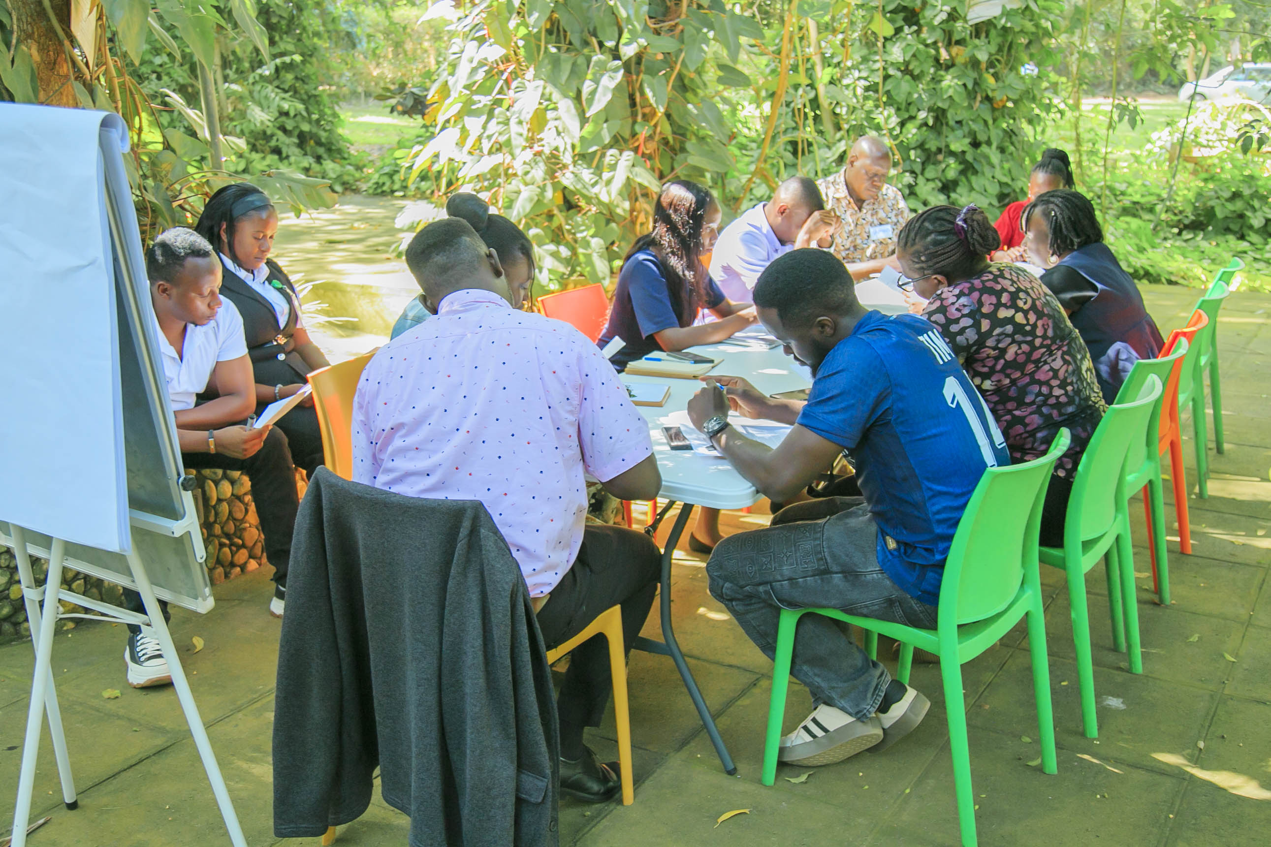 Participants discussing case scenarios during the breakout sessions on Day 1